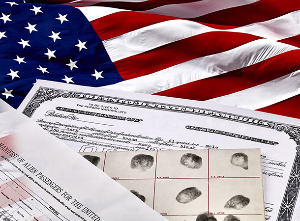 Immigration documents on top of a US flag